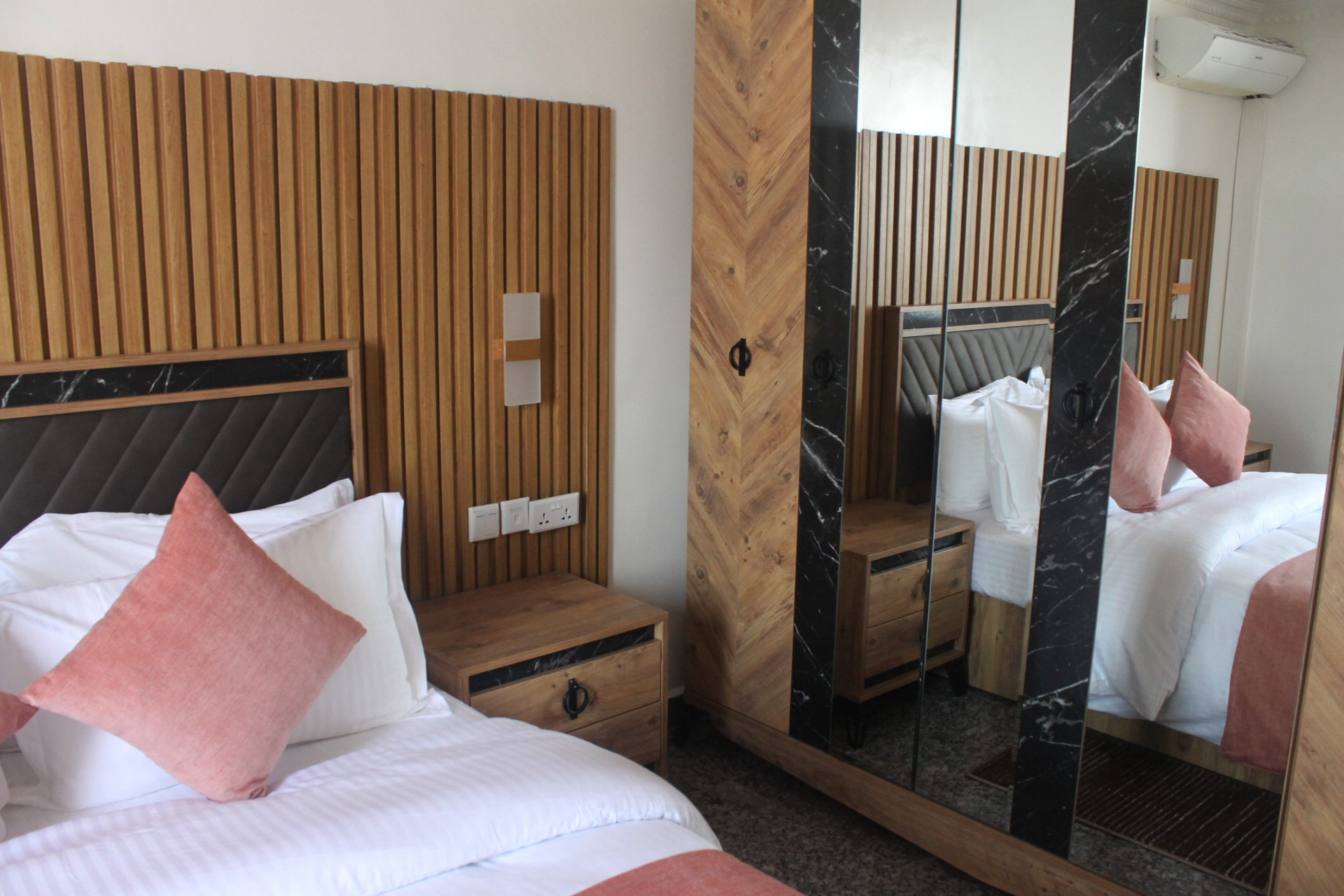 Rakka Hotel - Deluxe room with modern amenities and elegant interior design in Kigali